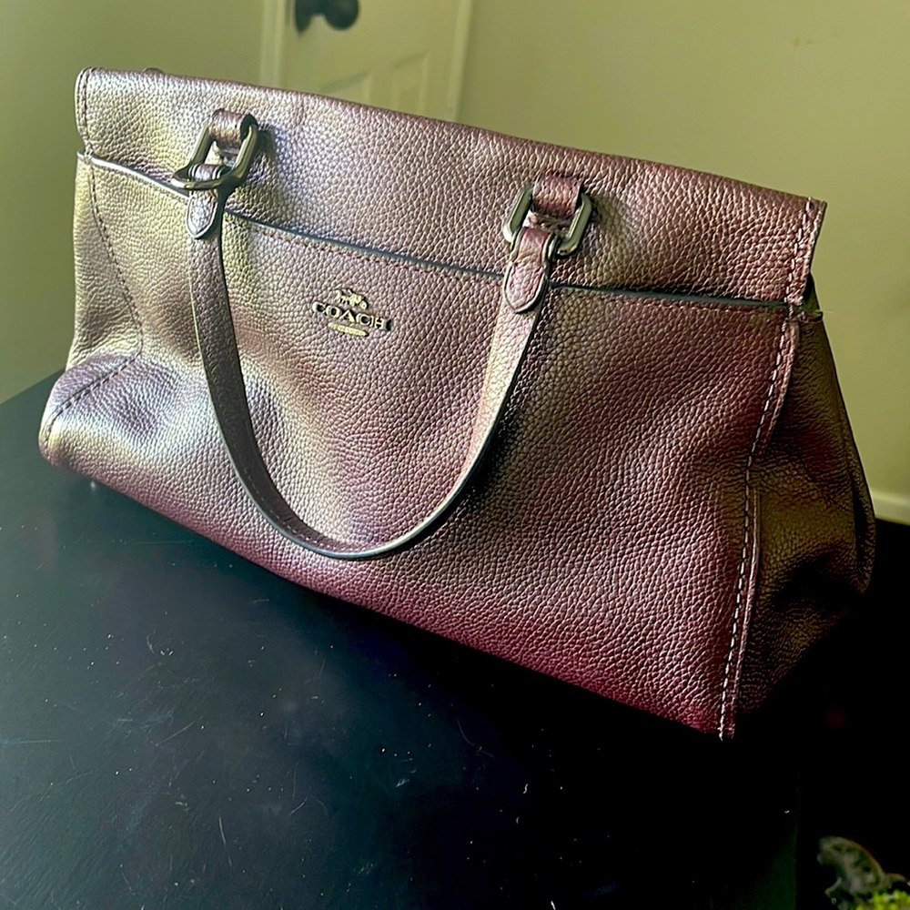 Dark brown/maroon color leather Real Coach bag.